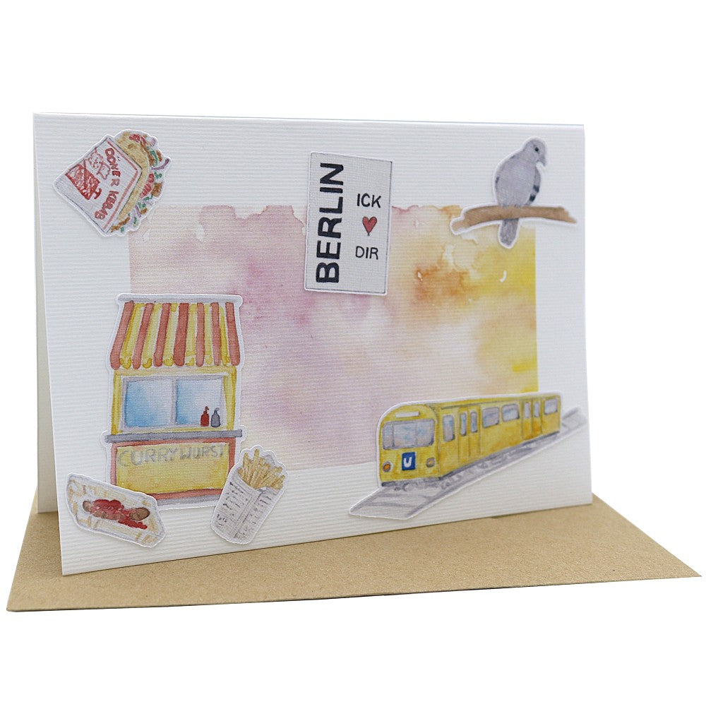 Berlin Klappkarte A6 mit Aquarellillustrationen eines Imbissstands, einer U-Bahn und typischen Berliner Motiven vor farbigem Hintergrund, mit Umschlag.