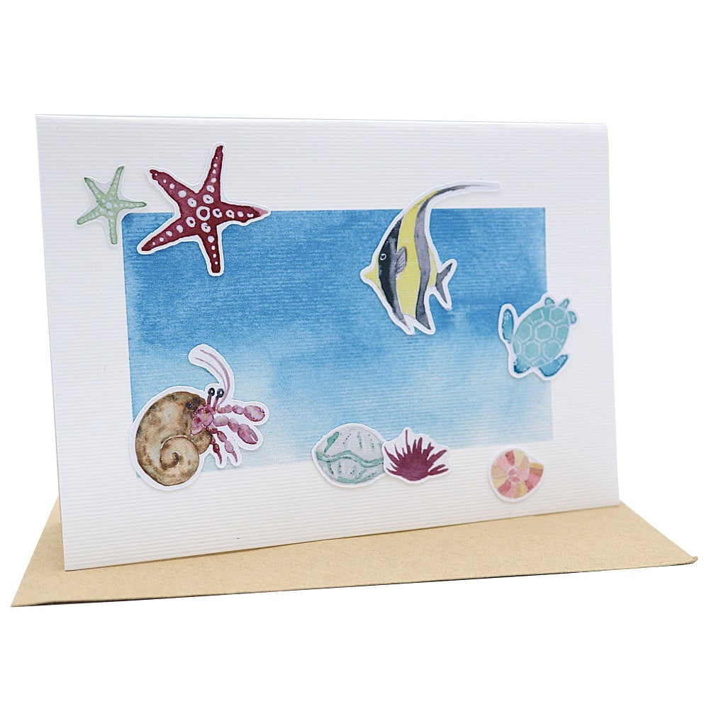 Klappkarte mit Unterwasser Szene, Motive Fische, Einsiedlerkrebs, Muscheln und Seesternen. 