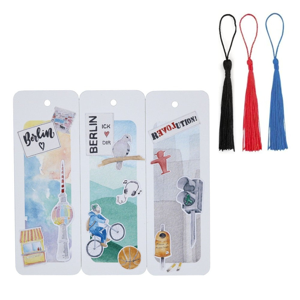 Berlin-Lesezeichen-Set mit drei Aquarell-Lesezeichen und farbigen Quasten in Schwarz, Rot und Blau.